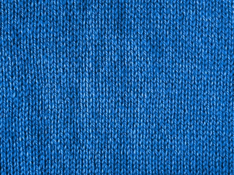 Blue knitted Jersey as textile background. Trendy blue color textule as color 2020 concept. Copy space for text and design.