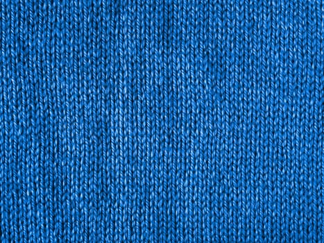 Blue knitted Jersey as textile background. Trendy blue color textule as color 2020 concept. Copy space for text and design.