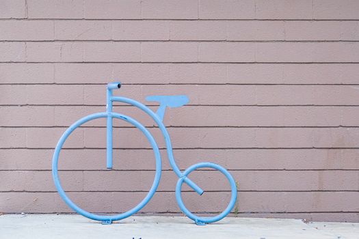 Steel Blue Bicycle Design on Plank Wall