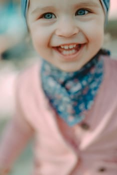 Adorable girl having fun on beautiful autumn day. Authentic picture.