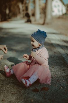 Adorable girl having fun on beautiful autumn day. Authentic picture.