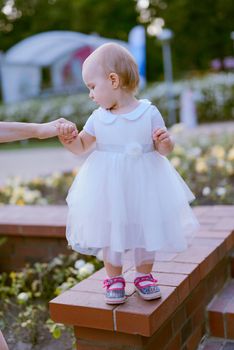 Smiling girl in the park in summer time. Authentic lifestyle image