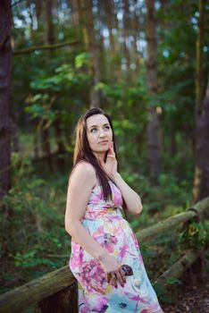 Autumn attractive woman portrait smiling outdoors at the park. Authentic and natural photographs