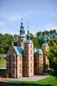 magical fascinating landscape with famous Rosenborg Castle near pond in palace garden in Copenhagen, Denmark. Exotic amazing places. Popular tourist atraction