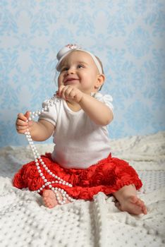 Portrait of adorable baby girl. Childhood. Authentic image