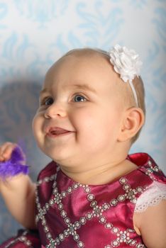 Portrait of adorable baby girl. Childhood. Authentic image