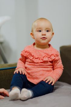 Portrait of adorable baby girl. Childhood.