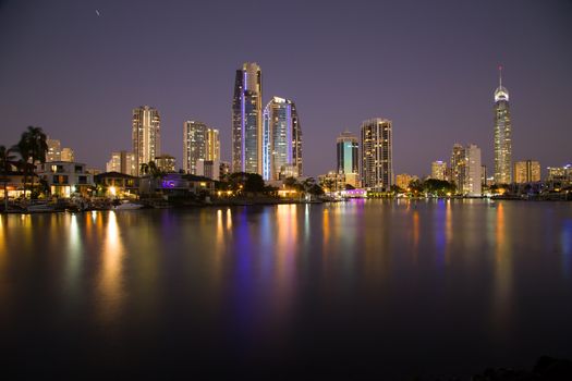 Long exposure shot with reflections of Surfers Paradise at dusk.