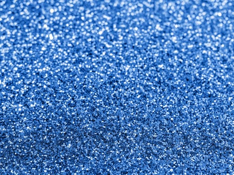 Sparkling background with bokeh made of Classic Blue 2020 color. Color of year 2020 blurred backdrop for holidays and parties. COY2020 Classic Blue concept. Copy space for text