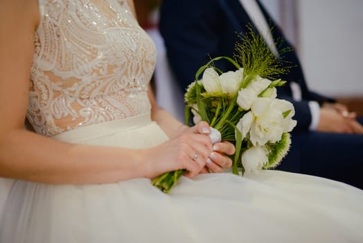 Bride and groom at church wedding during ceremony. Beautiful decoration