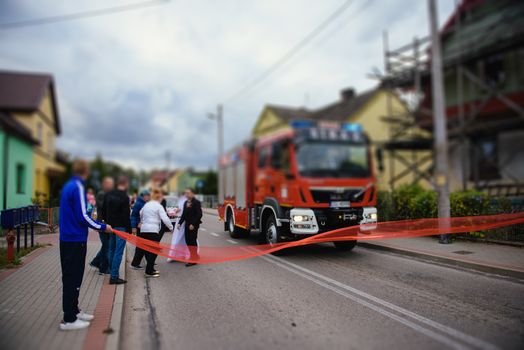Beautiful wedding couple on outdoor photoshoot with fire truck