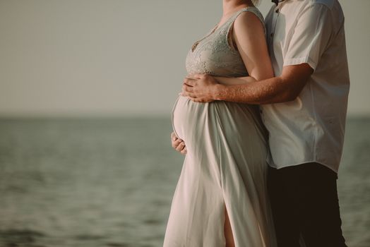 Bride and groom at a photo session in the nature. Baltic sea beach.