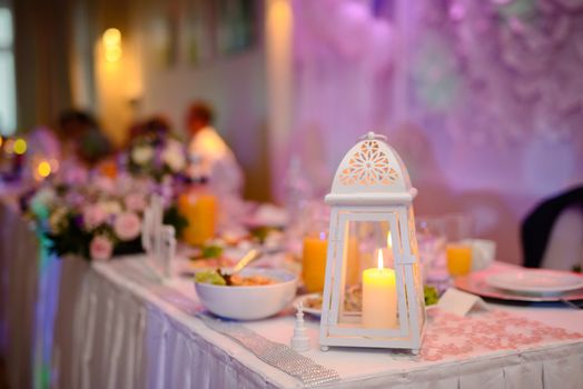 Beautifully decorated wedding table and other details at wedding hall. Wedding day