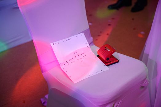 Decorated empty chairs at wedding party. Dancefloor.