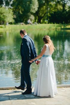 Bride and groom at a photo session in the nature.
