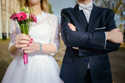Bride and groom at a photo session in the nature.