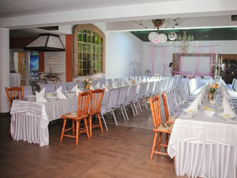 Beautifully decorated wedding table and other details at wedding hall. Wedding day
