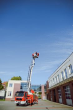 Beautiful wedding couple on outdoor photoshoot with fire truck
