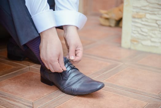 Groom black elegant shoes. Wedding detail. Close up