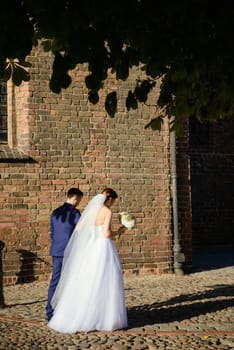 Church exterior during wedding ceremony. Blue sky with sunny weather