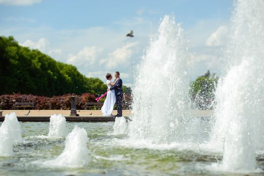 Bride and groom at a photo session in the nature.