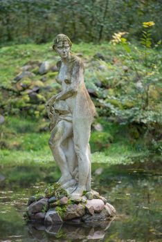 Classical woman statue or sculpture in the park. Valley of Love, Poland