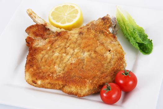 milanese cutlet on white background