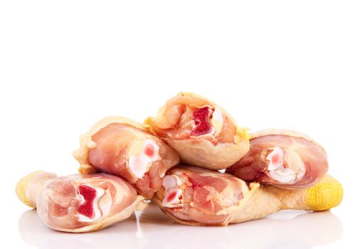 Fresh chicken thighs on white background