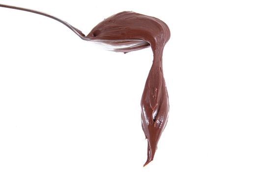 isolated chocolate cream on spoon on white background