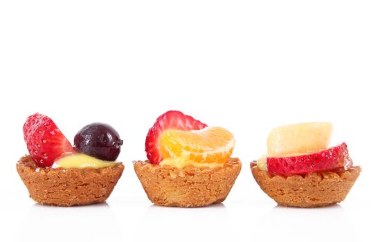 delicious fruit pastries on white background