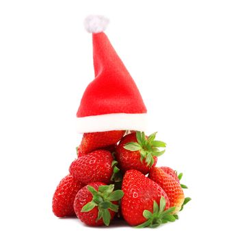 fresh strawberries on white background with christmas hat