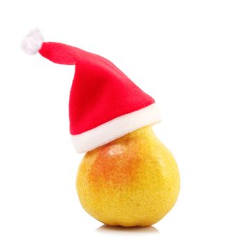 fresh pear with christmas hat on white background