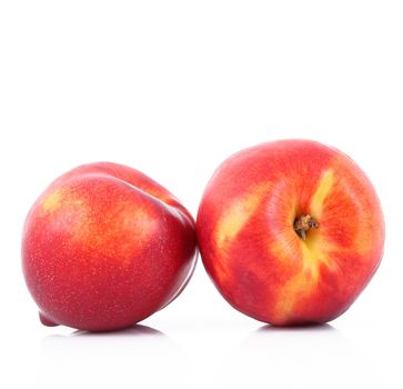 fresh peaches on white background