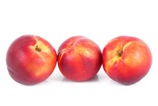 fresh peaches on white background