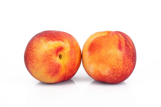 fresh peaches on white background