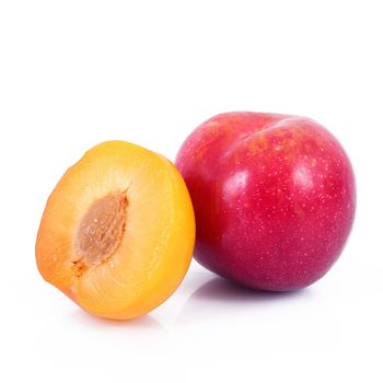 fresh plums on white background