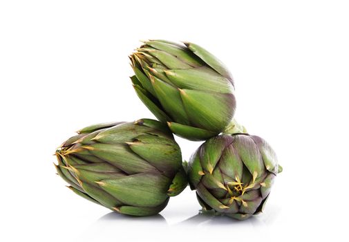 fresh artichokes on white background