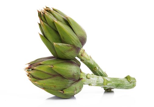 fresh artichokes on white background