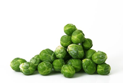 fresh brussels sprouts on white background