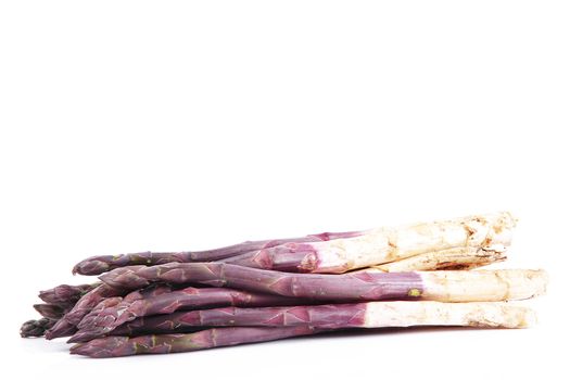 fresh red asparagus on white background