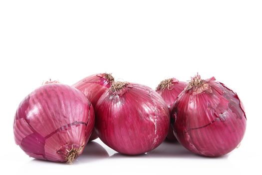 fresh red onions on white background