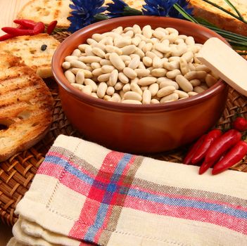 dry legumes in rustic dish on wooden table