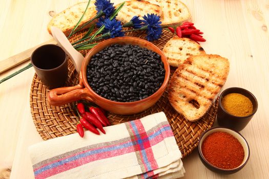 dry legumes in rustic dish on wooden table