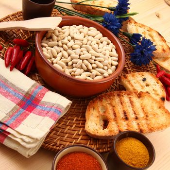 dry legumes in rustic dish on wooden table