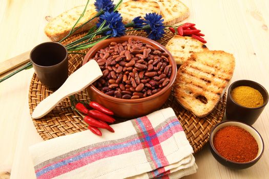 dry legumes in rustic dish on wooden table