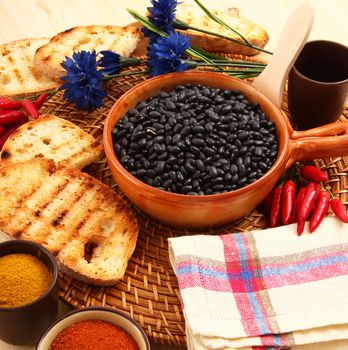 dry legumes in rustic dish on wooden table
