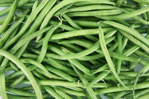 fresh green beans on white background