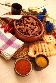dry legumes in rustic dish on wooden table