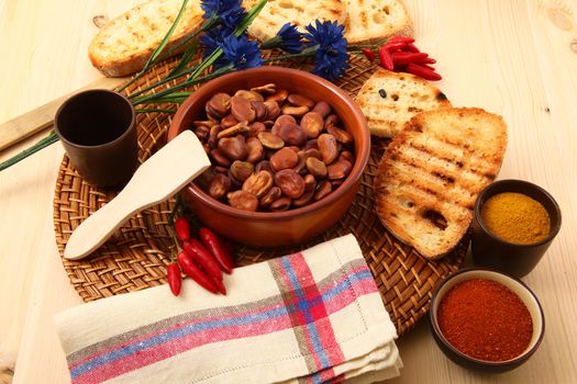 dry legumes in rustic dish on wooden table