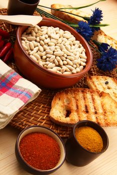dry legumes in rustic dish on wooden table